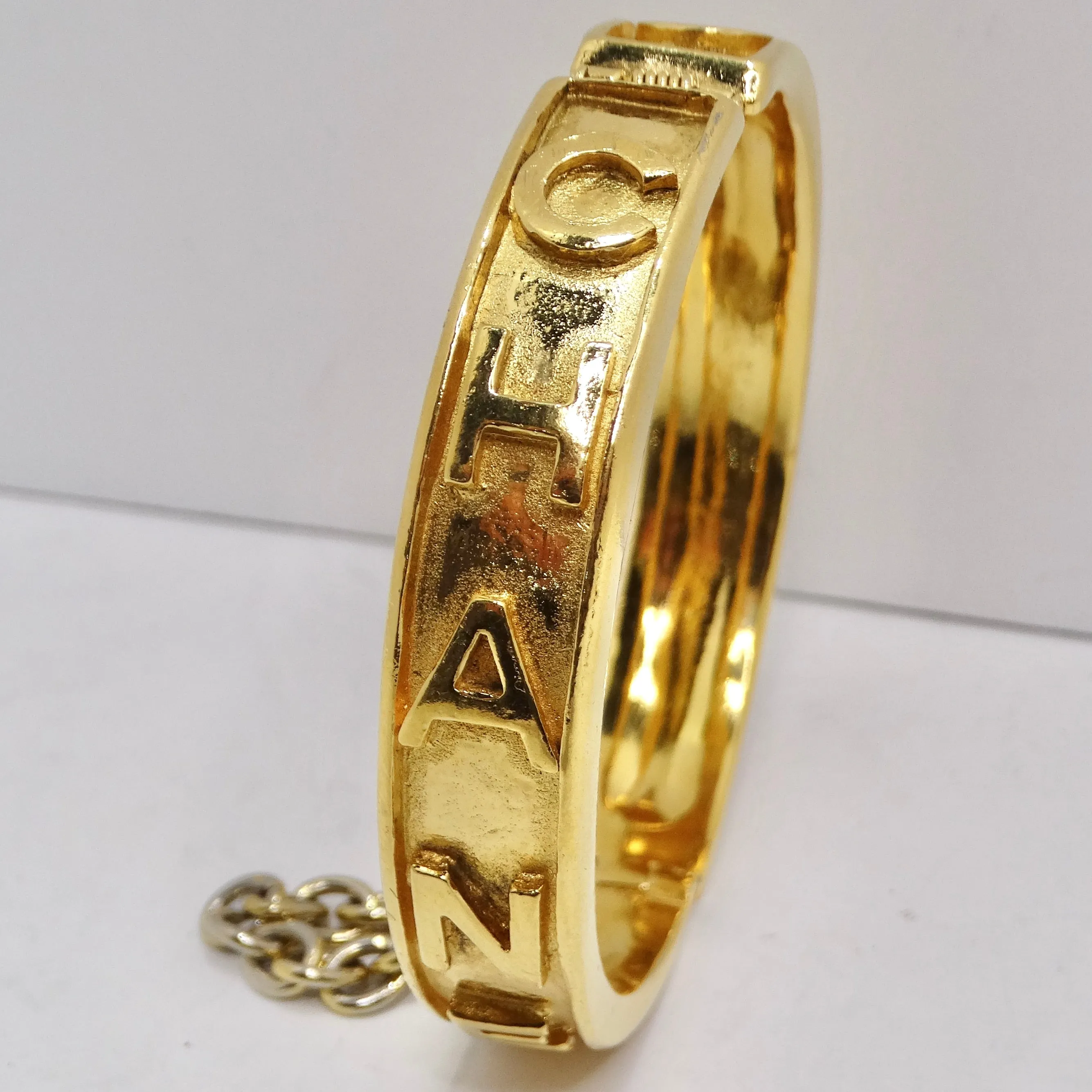 Chanel 1980s Gold Tone Logo Bangle